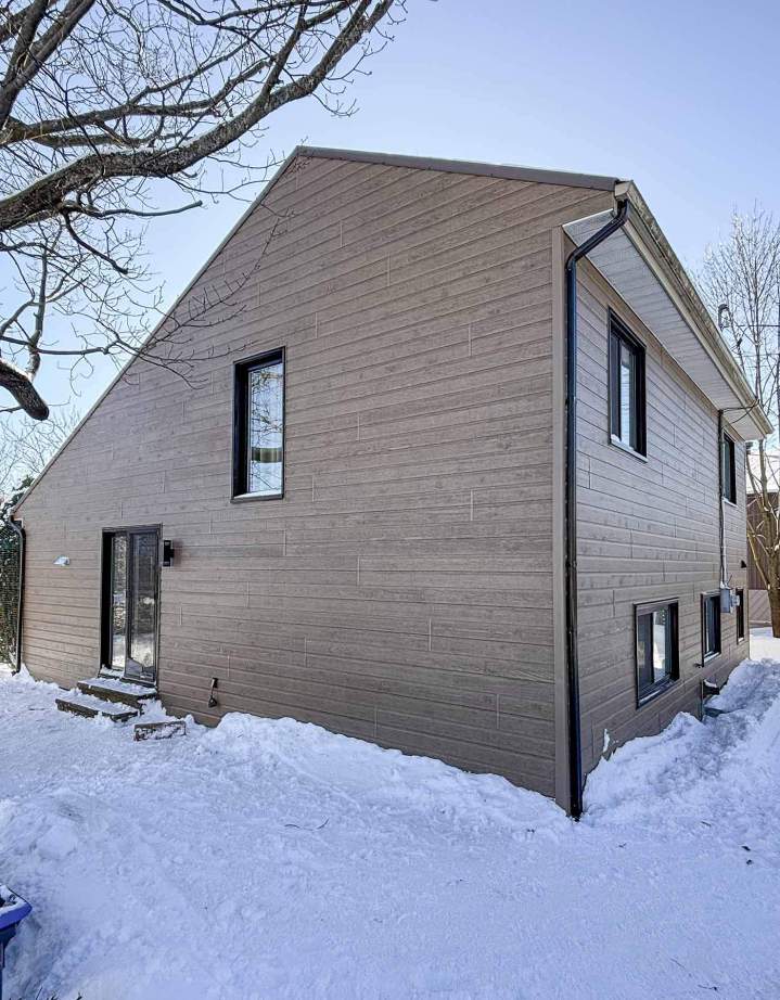 Pose de revêtement de façade, Lévis